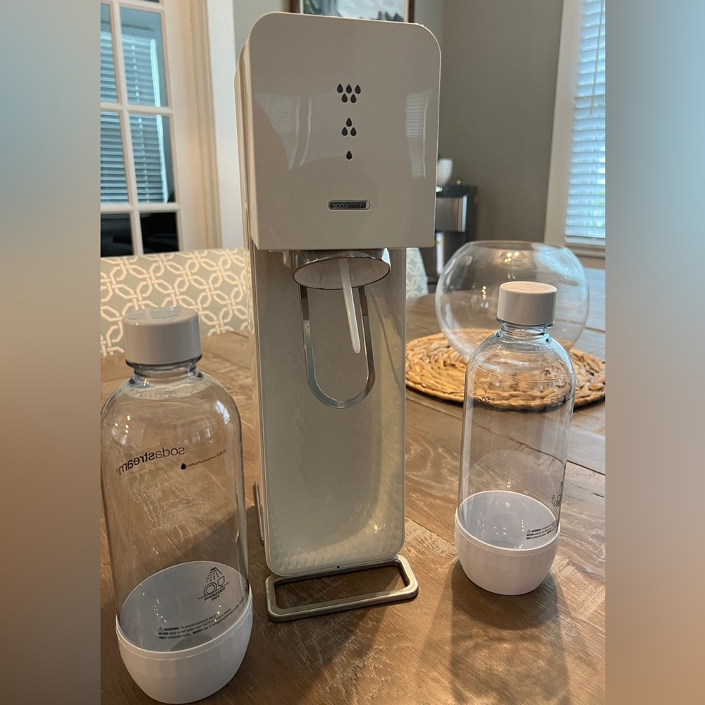 Used soda stream - works great! Comes with two soda stream bottles